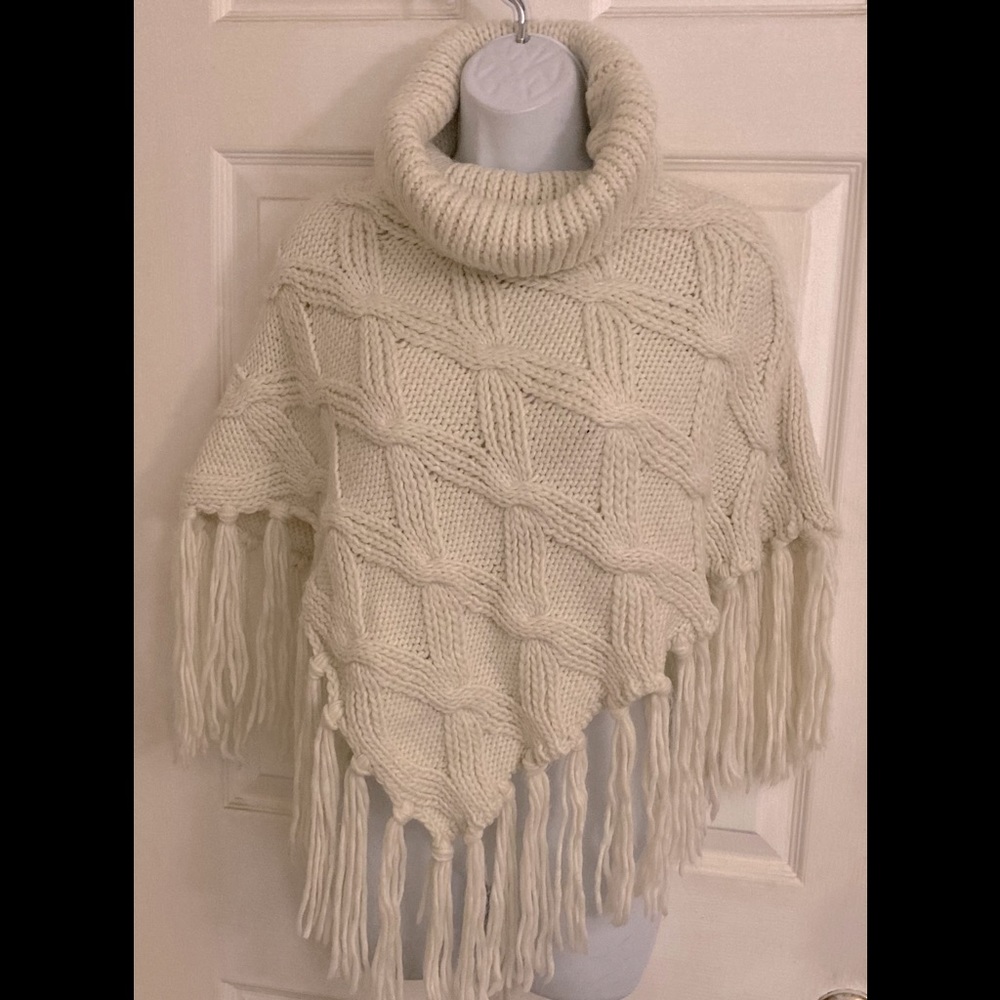 Elegant Cream Knit Poncho with Fringe